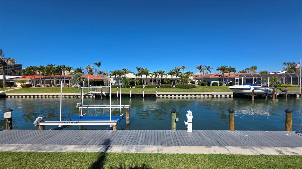 531 Birdie Lane Longboat Key, FL 34228 - Photo 42 of 43 a view of a lake with a city