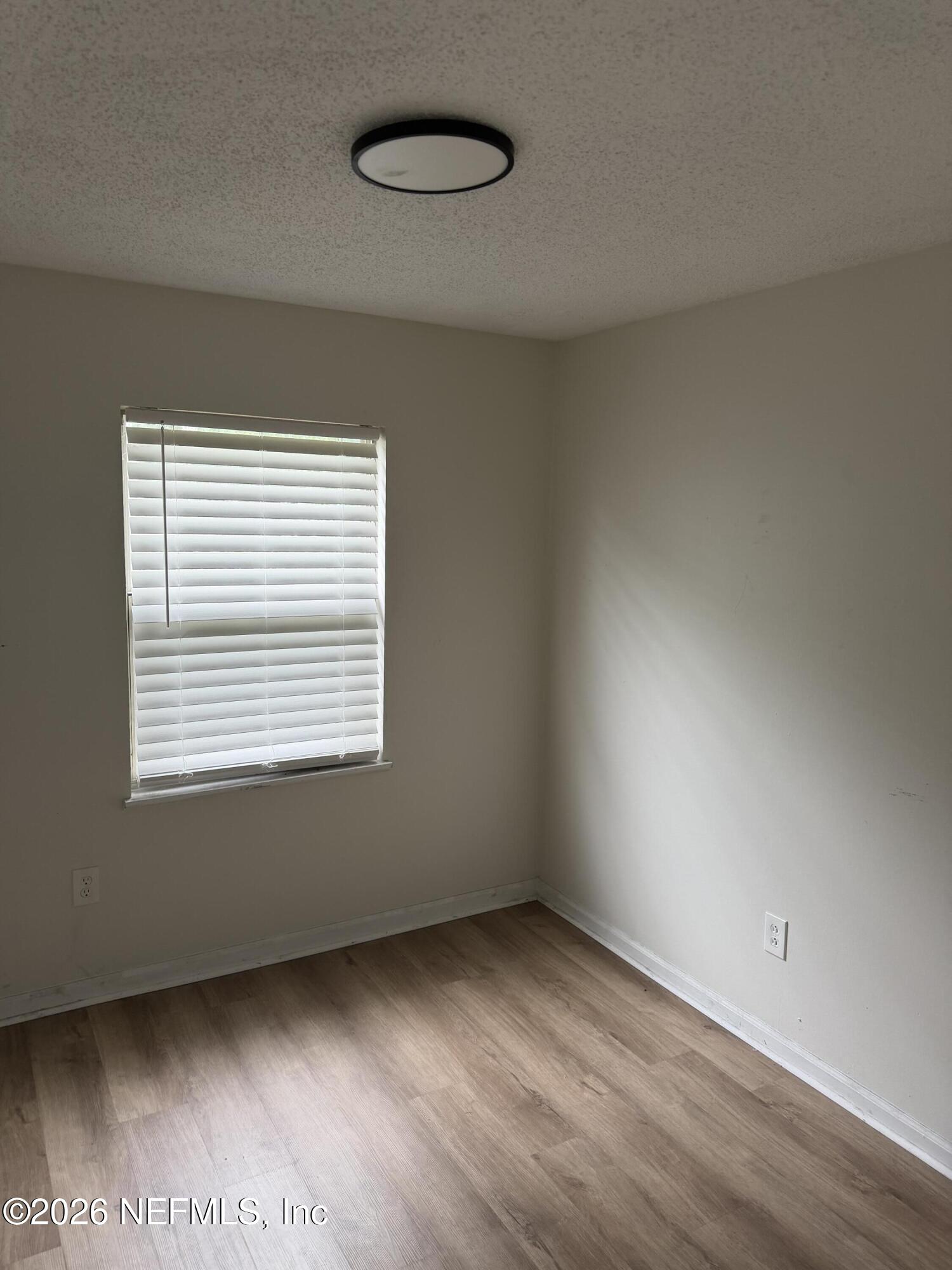 7539 Walden Road Jacksonville, FL 32244 - Photo 2 of 18 an empty room with a window