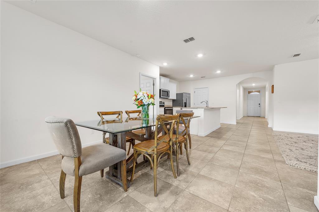6295 Northwest Regent Street Port St. Lucie, FL 34983 - Photo 11 of 22 a view of a dining room with furniture