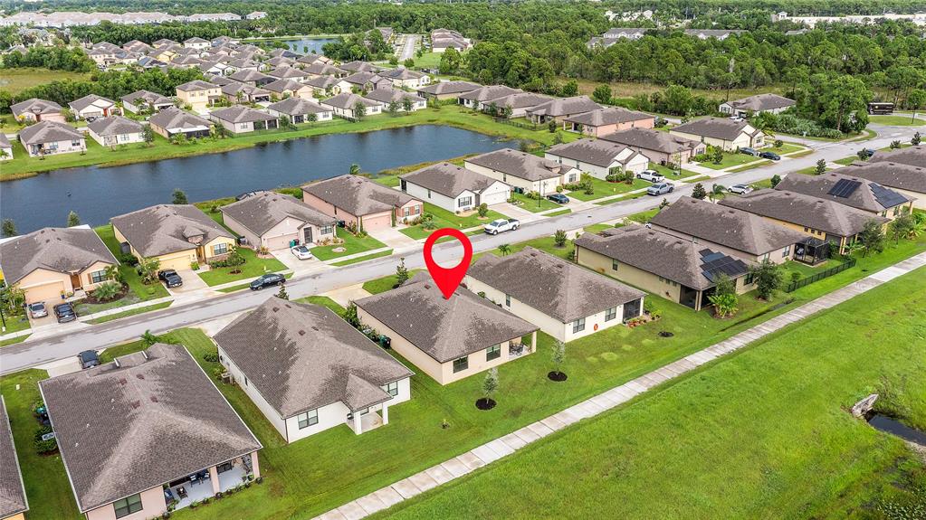 6295 Northwest Regent Street Port St. Lucie, FL 34983 - Photo 21 of 22 an aerial view of residential houses with outdoor space