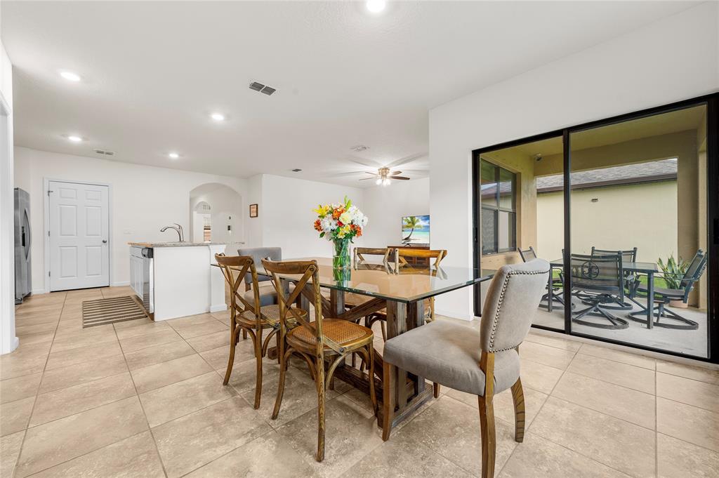 6295 Northwest Regent Street Port St. Lucie, FL 34983 - Photo 10 of 22 a view of a dining room with furniture