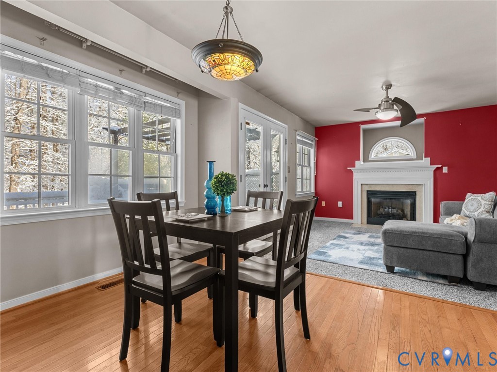 11718 Corte Castle Road Chesterfield, VA 23838 - Photo 19 of 50 Dining space with a glass covered fireplace, light