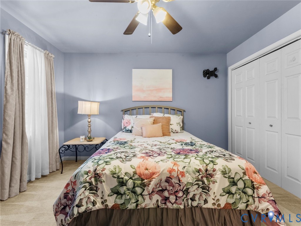 11718 Corte Castle Road Chesterfield, VA 23838 - Photo 38 of 50 Bedroom with light colored carpet, a closet, and c