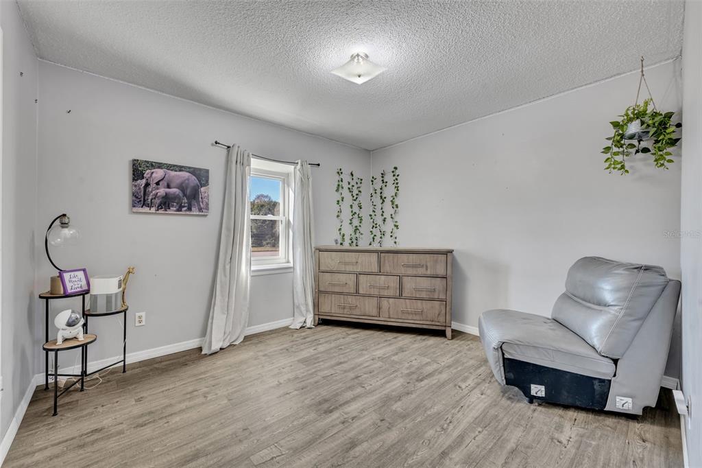 222 West Panama Road Winter Springs, FL 32708 - Photo 14 of 25 a room with furniture and a wooden floor