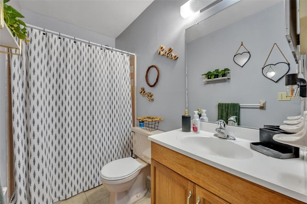 222 West Panama Road Winter Springs, FL 32708 - Photo 15 of 25 a bathroom with a granite countertop toilet sink and mirror