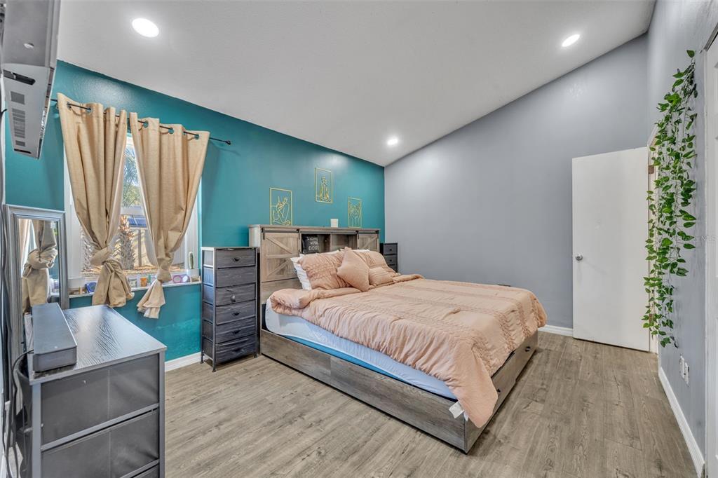 222 West Panama Road Winter Springs, FL 32708 - Photo 16 of 25 a bedroom with a bed and large windows