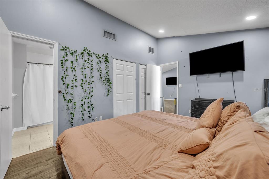 222 West Panama Road Winter Springs, FL 32708 - Photo 17 of 25 a bedroom with a bed and a flat screen tv