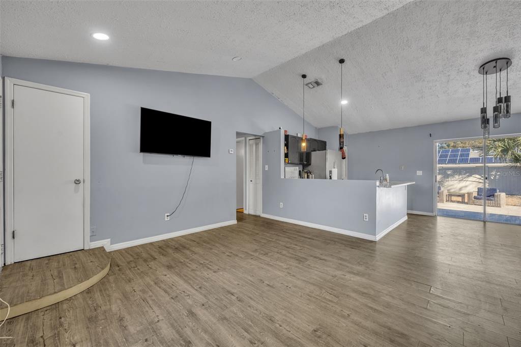 222 West Panama Road Winter Springs, FL 32708 - Photo 5 of 25 a view of a livingroom with furniture and a flat screen tv