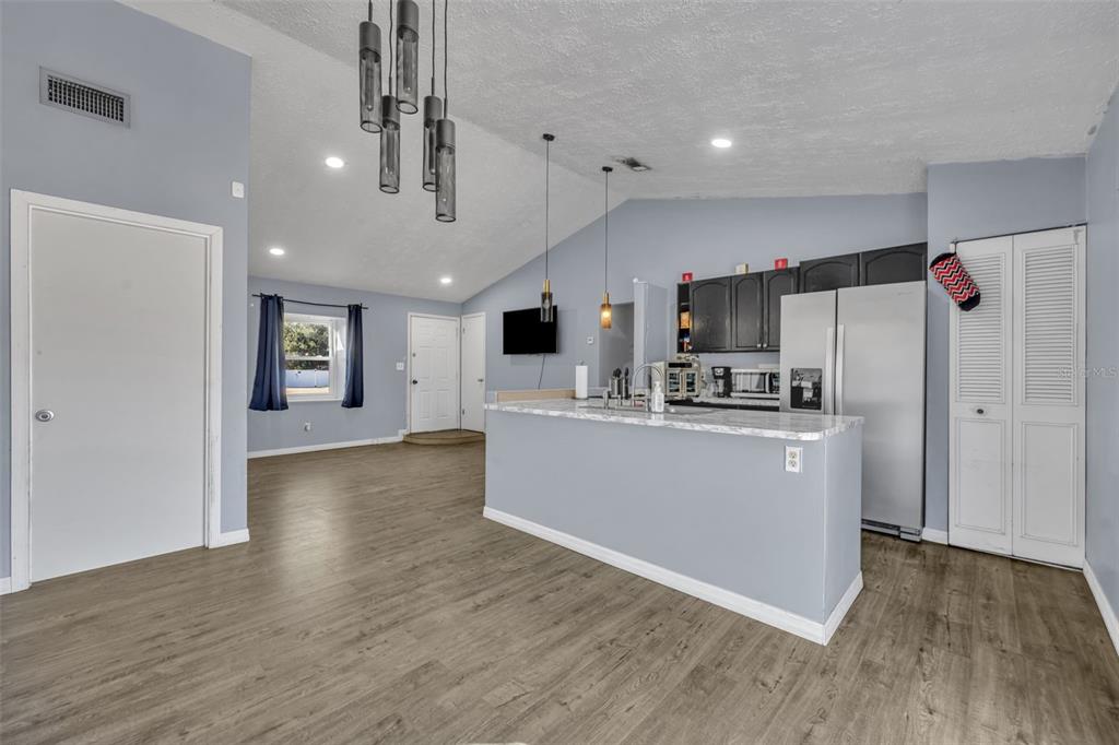 222 West Panama Road Winter Springs, FL 32708 - Photo 8 of 25 a view of kitchen with cabinets stainless steel appliances and wooden floor