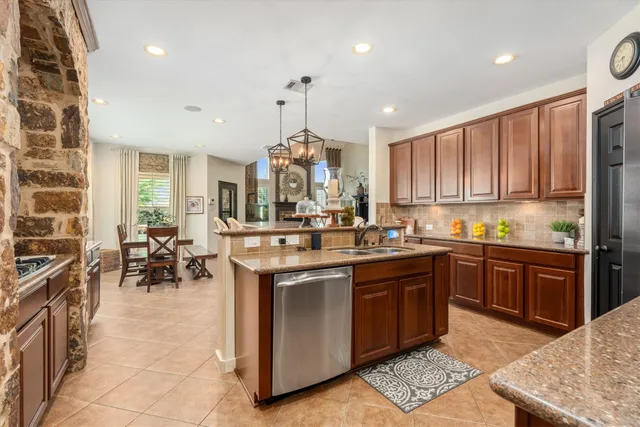 a kitchen with a sink stove and cabinets