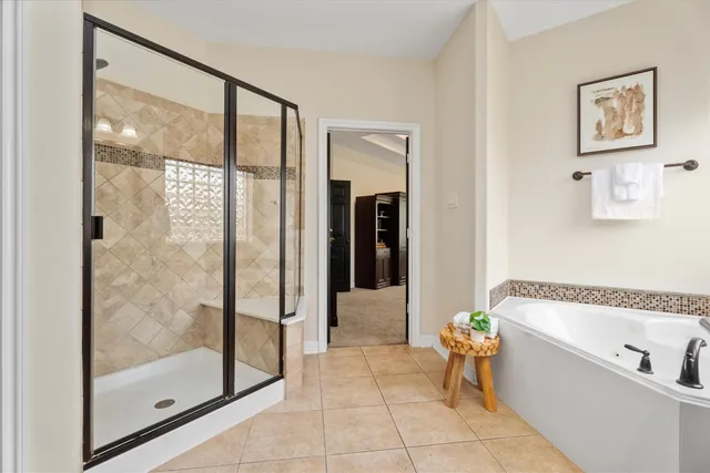 a bathroom with a bathtub and a shower