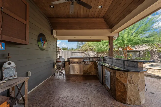 a kitchen with a stove a refrigerator and wooden cabinets
