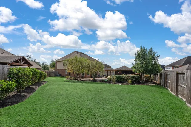 a view of a park with large trees