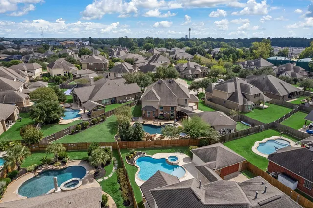 an aerial view of a houses with outdoor space