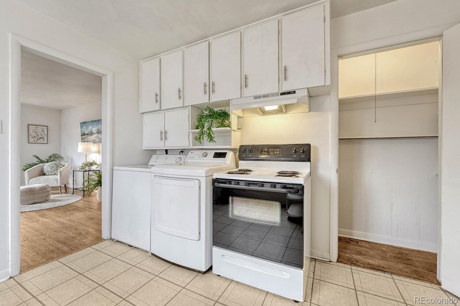 765 Moline Street Aurora, CO 80010 - Photo 12 of 26 a kitchen with appliances cabinets and a window