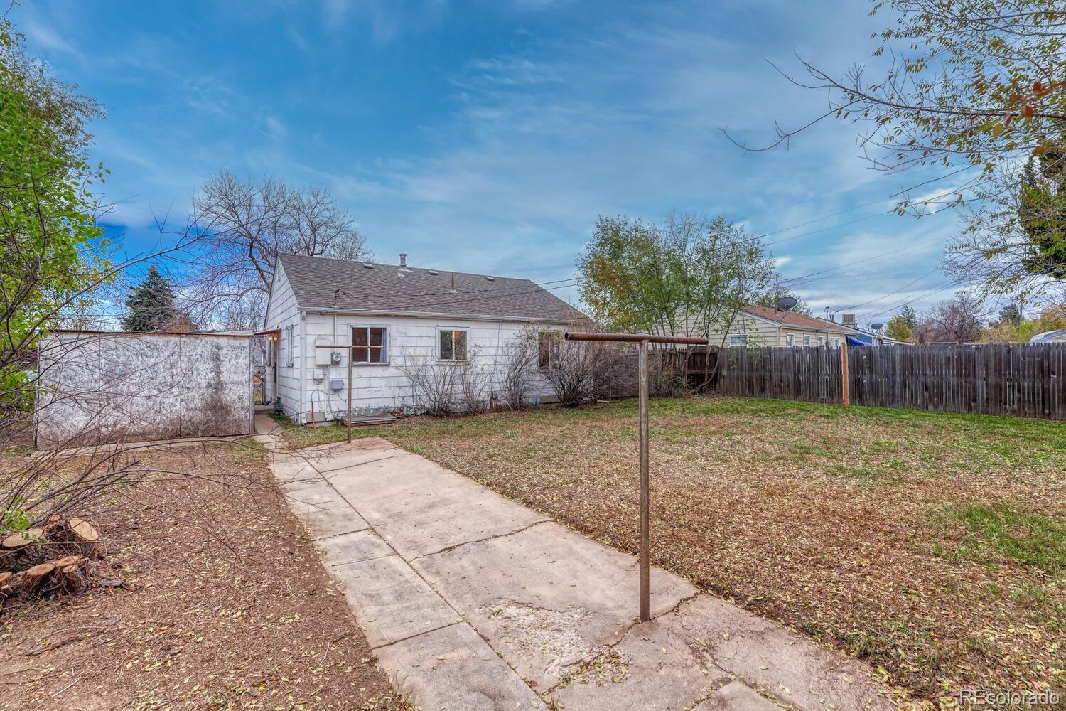 765 Moline Street Aurora, CO 80010 - Photo 23 of 26 a view of a house with a backyard