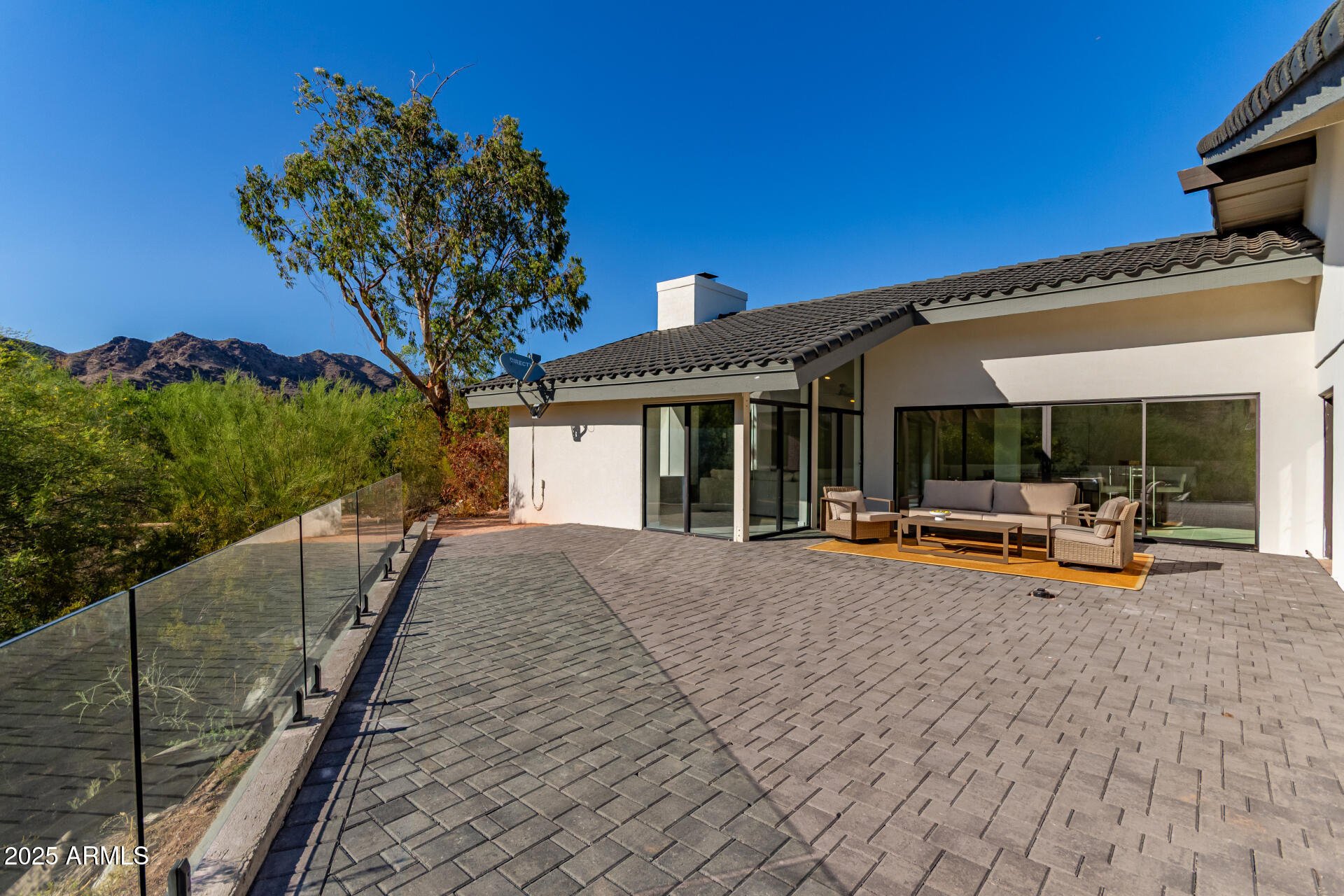 3301 East Rovey Avenue Paradise Valley, AZ 85253 - Photo 84 of 105 a view of a house with backyard sitting area and roof