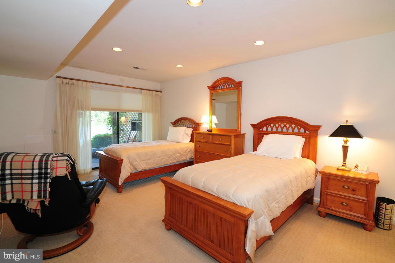 2012 Lakewinds Drive Reston, VA 20191 - Photo 21 of 26 a bedroom with two beds and a dresser with the shoe rack
