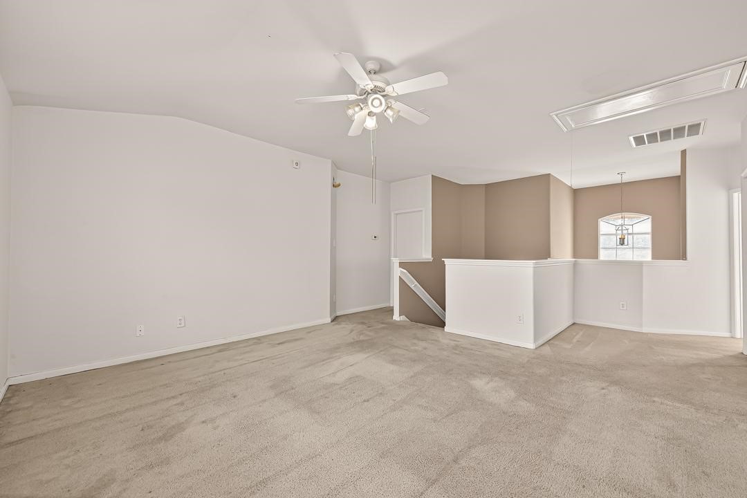 23514 Hidden Maple Drive Spring, TX 77373 - Photo 12 of 23 a view of a livingroom with a ceiling fan and a ceiling fan