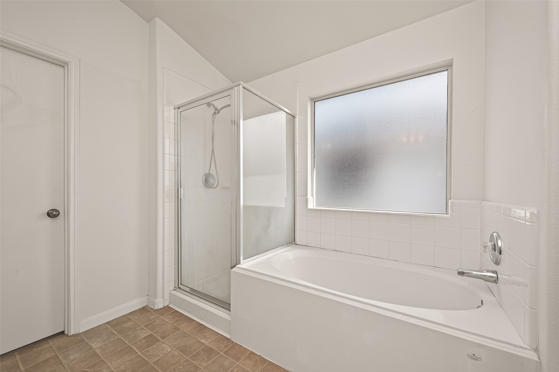 23514 Hidden Maple Drive Spring, TX 77373 - Photo 18 of 23 a white bath tub sitting next to a shower