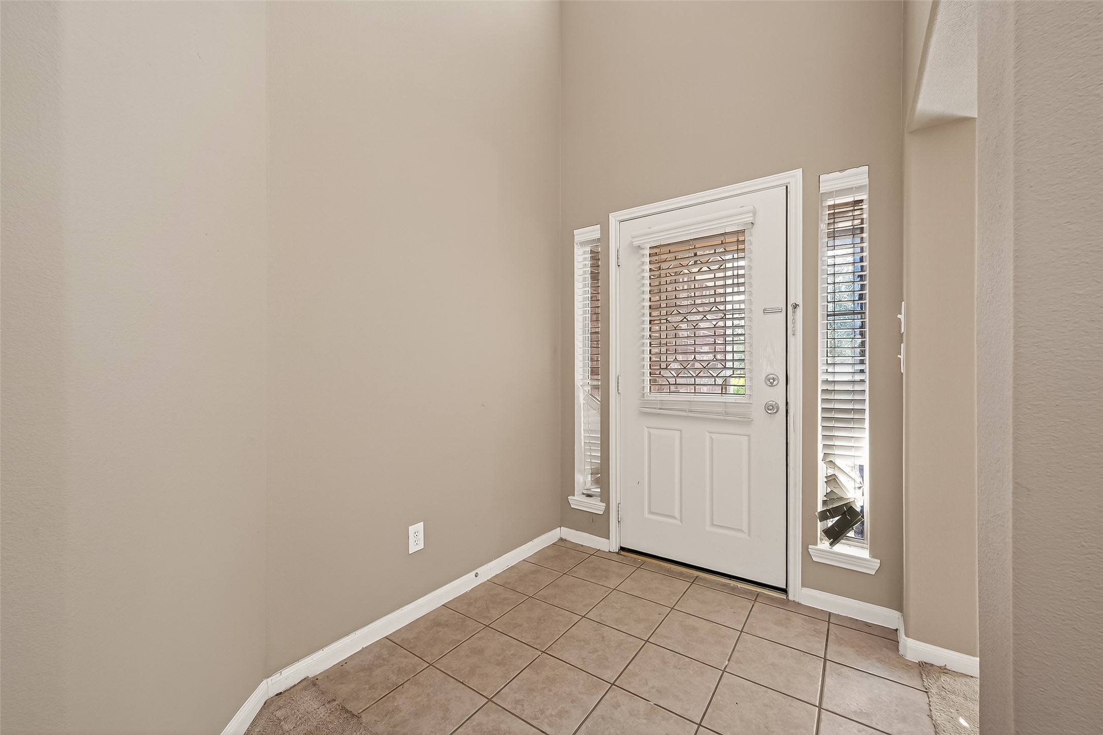 23514 Hidden Maple Drive Spring, TX 77373 - Photo 2 of 23 a view of an empty room with windows