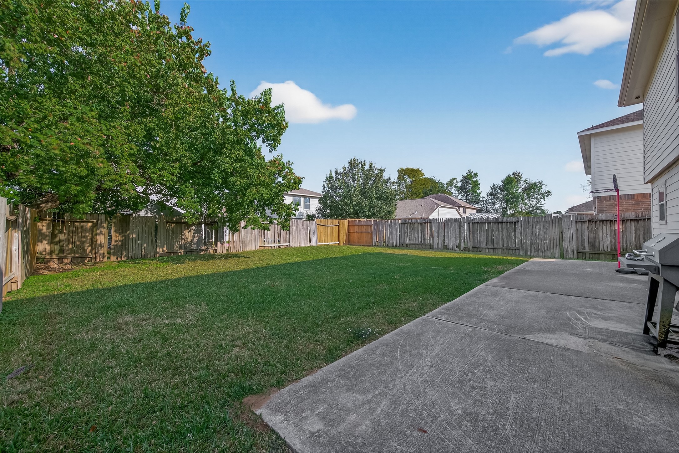 23514 Hidden Maple Drive Spring, TX 77373 - Photo 22 of 23 a view of a yard with a house in the background