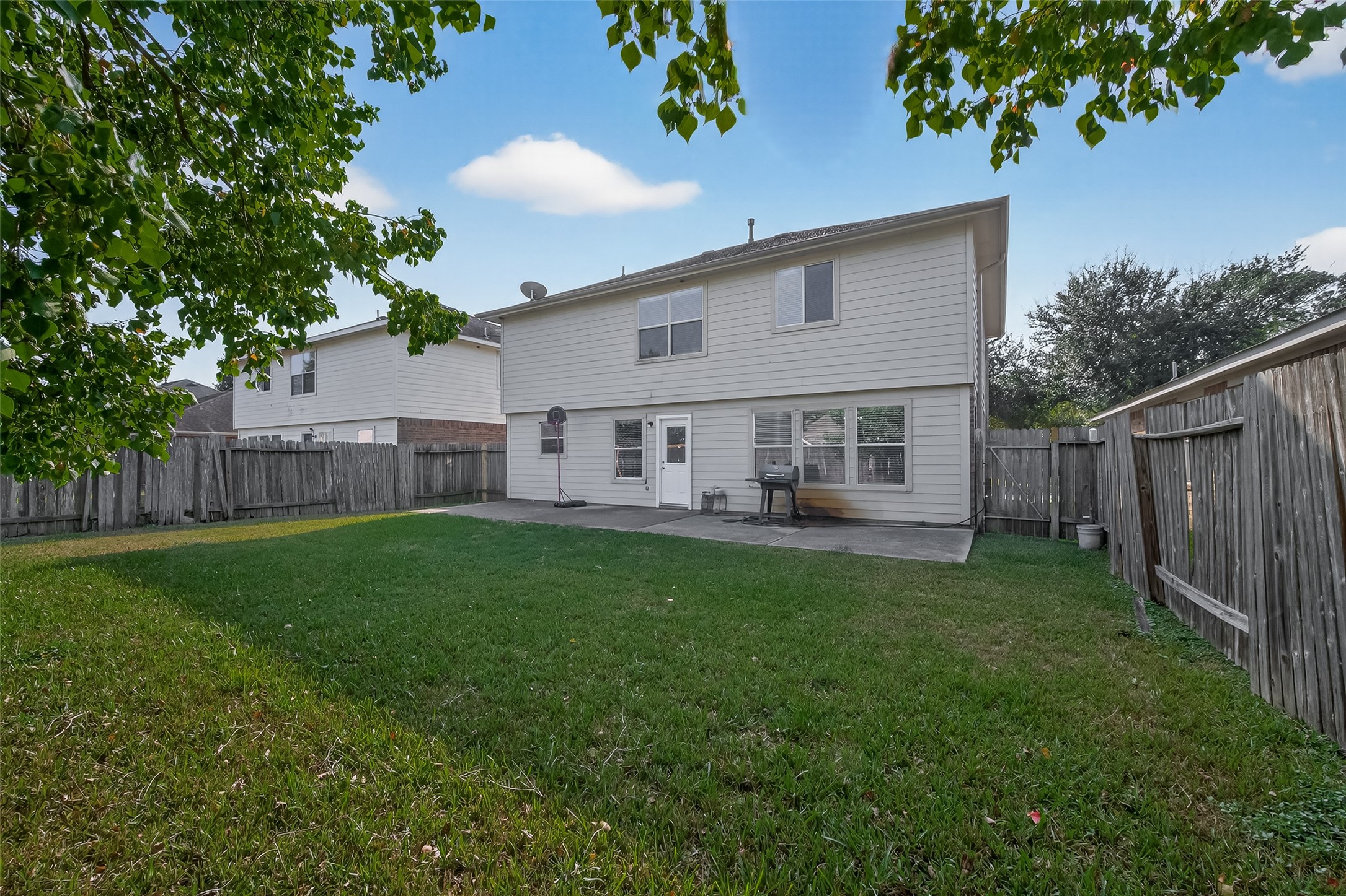 23514 Hidden Maple Drive Spring, TX 77373 - Photo 23 of 23 a view of a house with backyard and sitting area