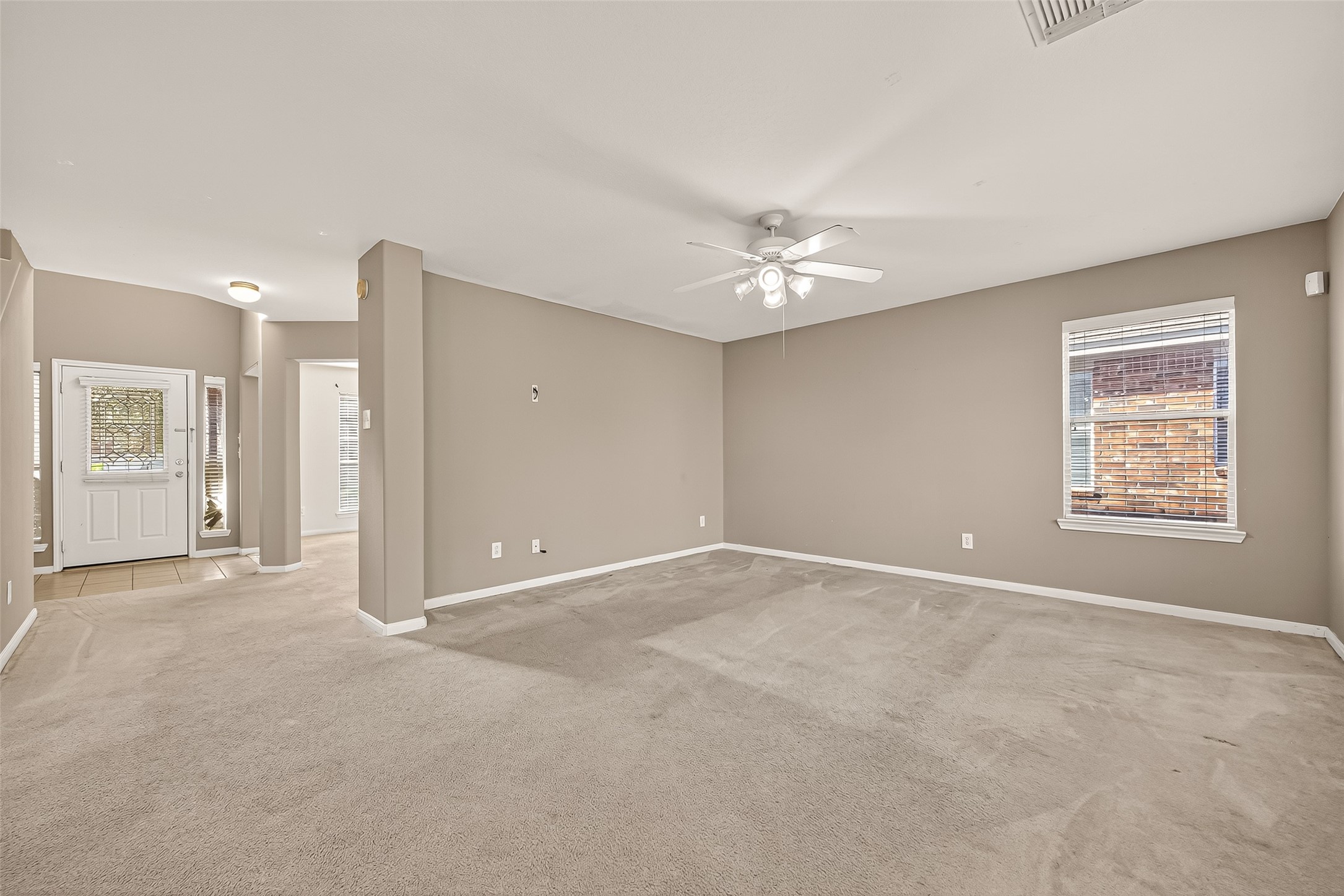23514 Hidden Maple Drive Spring, TX 77373 - Photo 6 of 23 an empty room with fan and windows
