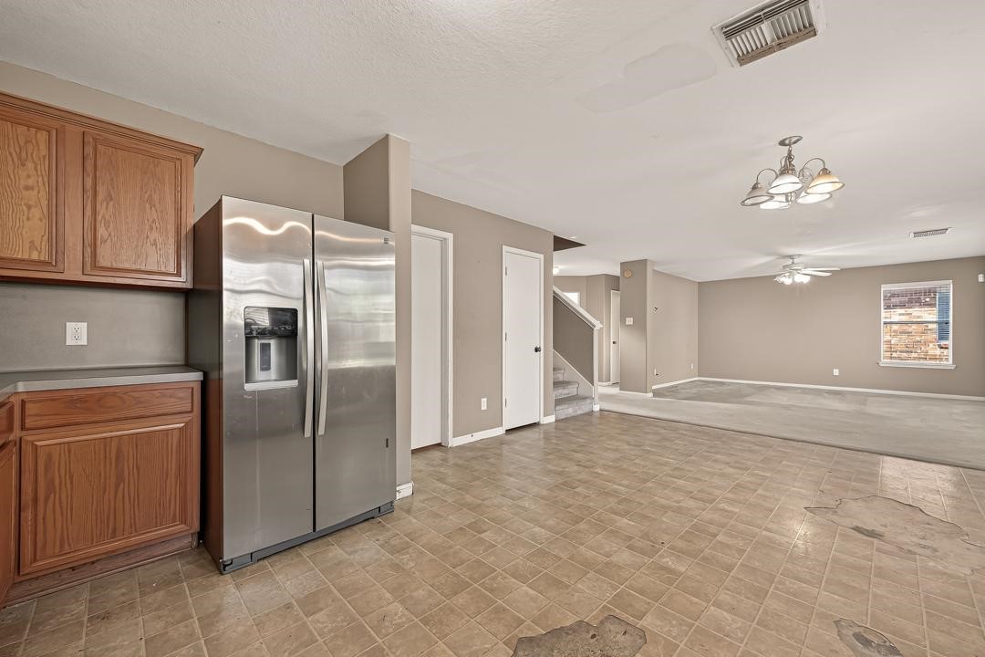 23514 Hidden Maple Drive Spring, TX 77373 - Photo 8 of 23 a kitchen with stainless steel appliances granite countertop a refrigerator and a stove top oven