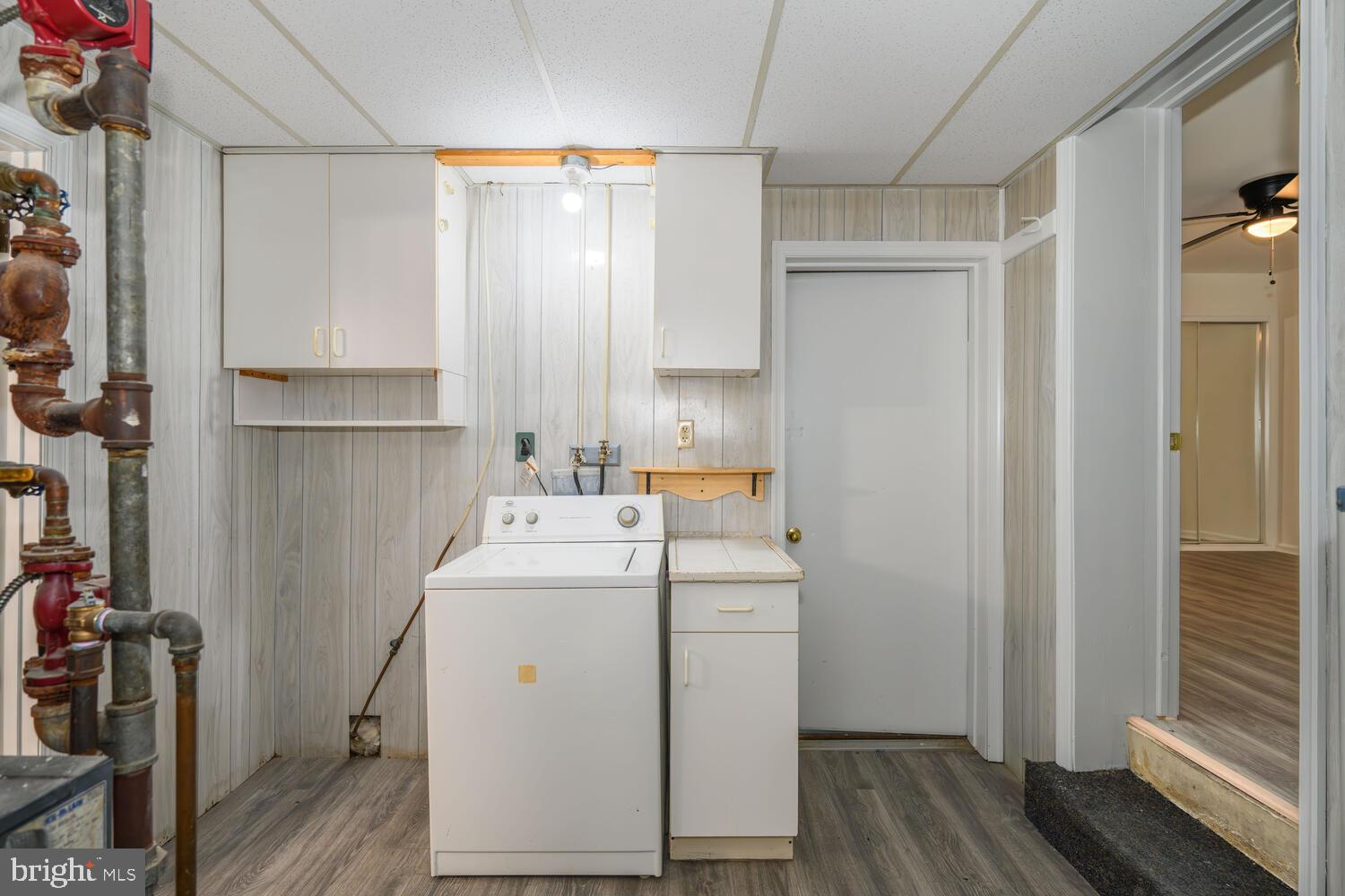 6746 Quaker Neck Road Chestertown, MD 21620 - Photo 30 of 50 a utility room with cabinets washer and dryer