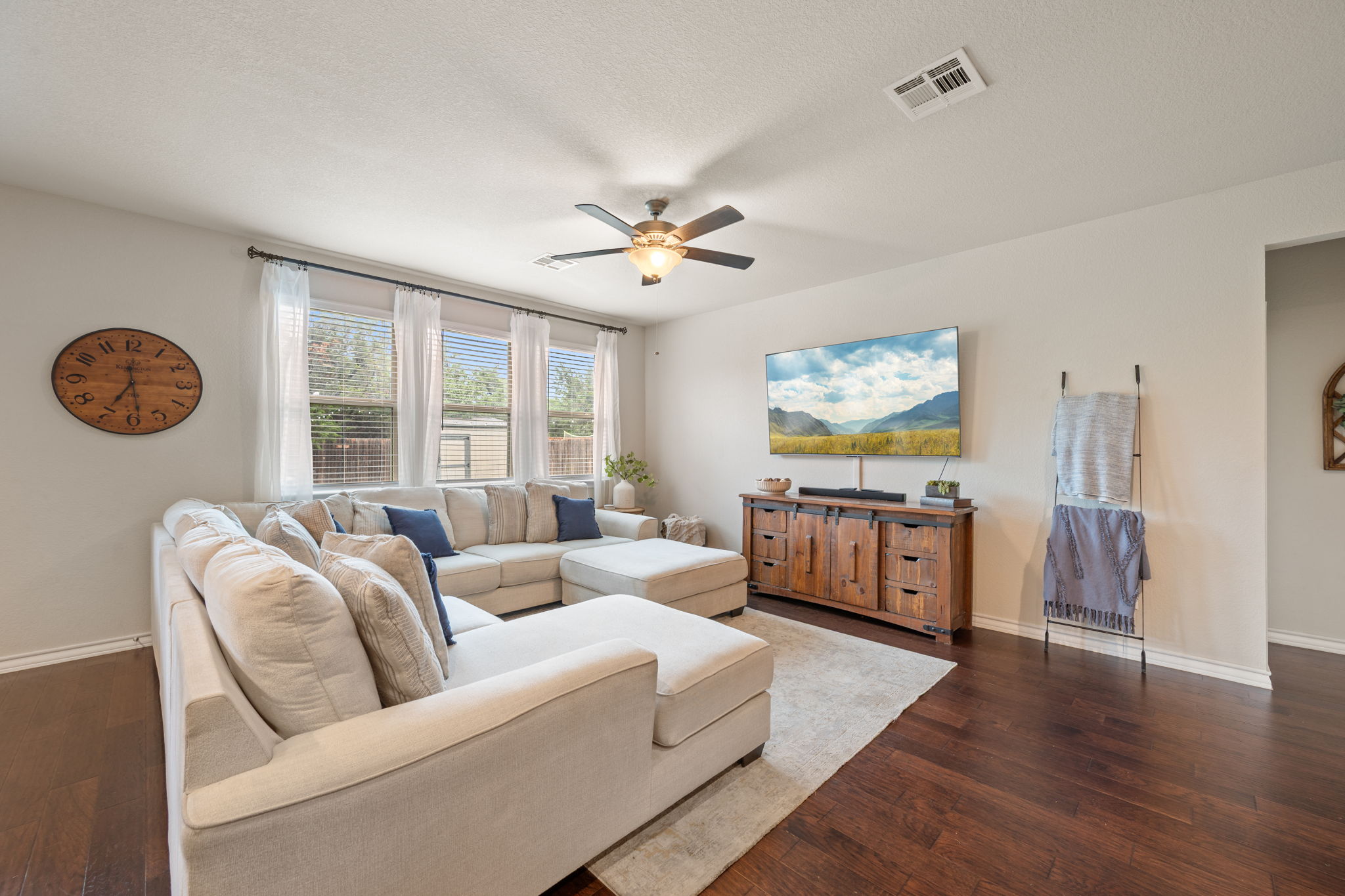 409 Limestone Road Liberty Hill, TX 78642 - Photo 10 of 35 a living room with furniture and a large window