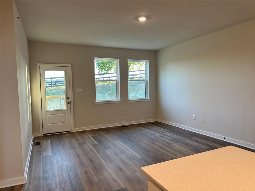 202 Hanover Lane Washington, PA 15342 - Photo 4 of 24 an empty room with wooden floor and windows