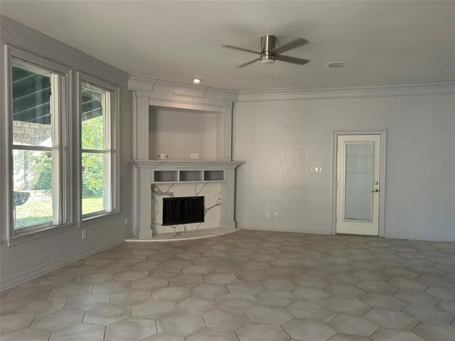 a view of a kitchen with a sink a kitchen a refrigerator and a fireplace