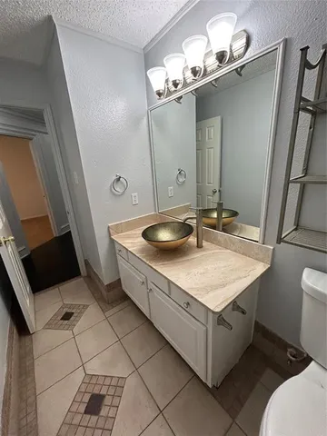 en empty room with windows and fan