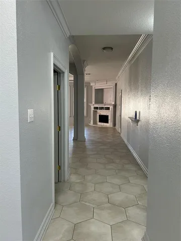 a view of a hallway with a kitchen