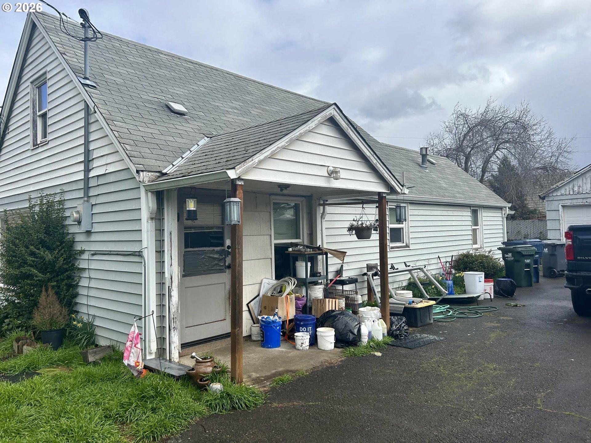 a view of a house with sitting area and garden