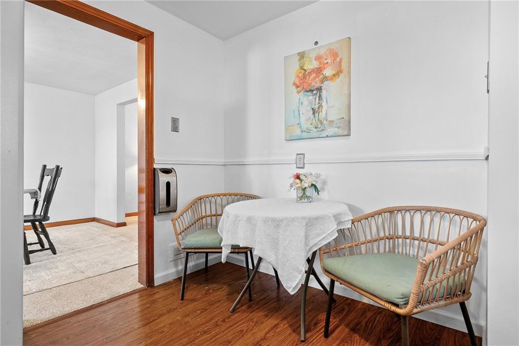 1620 Methyl Street Pittsburgh, PA 15216 - Photo 16 of 45 a view of a dining room with furniture and wooden floor