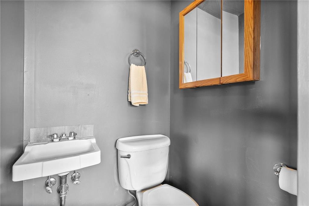 1620 Methyl Street Pittsburgh, PA 15216 - Photo 21 of 45 a bathroom with a toilet sink and mirror