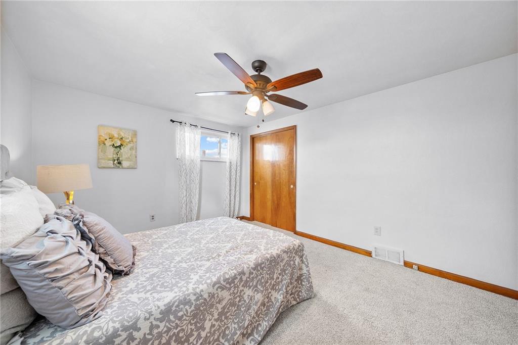 1620 Methyl Street Pittsburgh, PA 15216 - Photo 25 of 45 a bedroom with a large bed and a ceiling fan