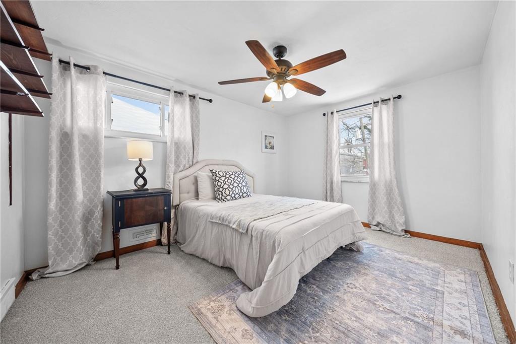 1620 Methyl Street Pittsburgh, PA 15216 - Photo 30 of 45 a bedroom with a bed and a chandelier