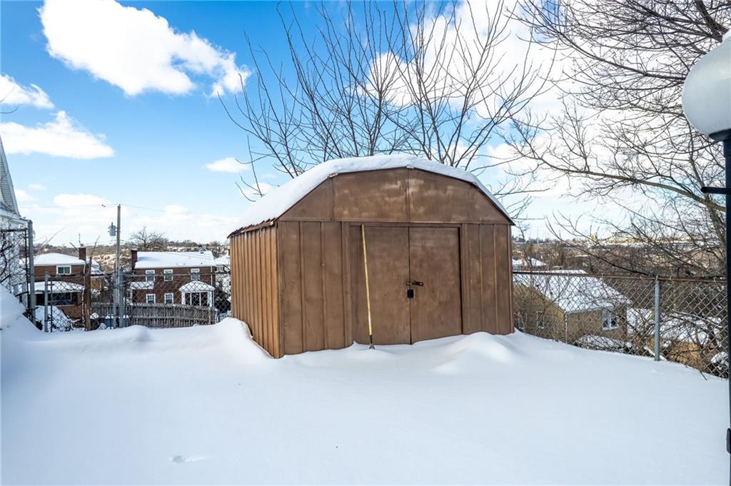 1620 Methyl Street Pittsburgh, PA 15216 - Photo 40 of 45 a view of a house with a yard covered in snow