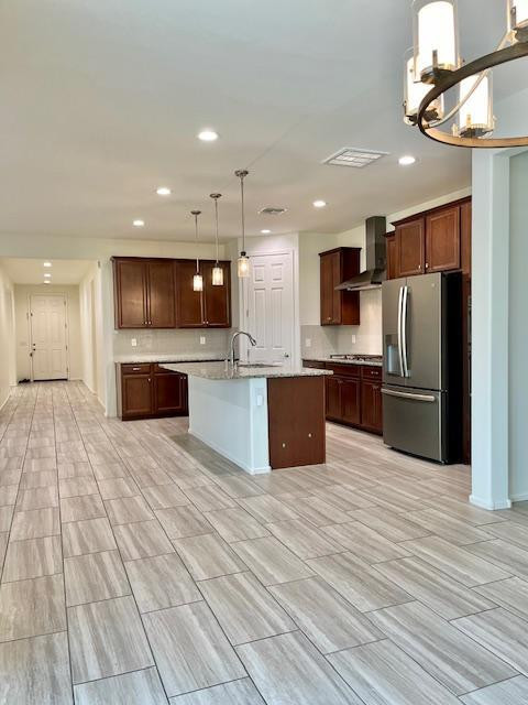 71 West Megan Street Gilbert, AZ 85233 - Photo 12 of 39 a large kitchen with stainless steel appliances kitchen island a large counter top and oven