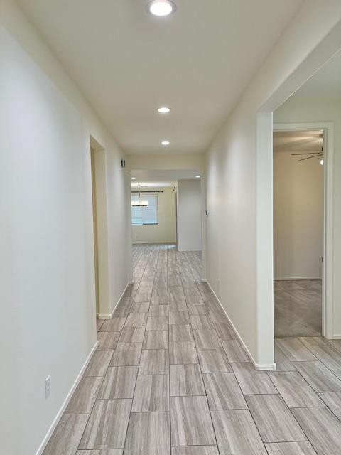 71 West Megan Street Gilbert, AZ 85233 - Photo 14 of 39 wooden floor in an empty room with a window