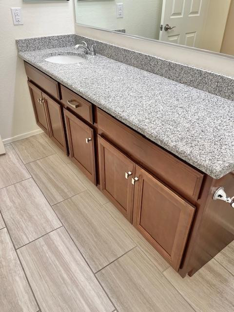 71 West Megan Street Gilbert, AZ 85233 - Photo 18 of 39 a kitchen with granite countertop sink and cabinets