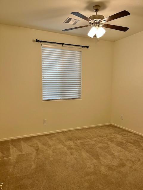 71 West Megan Street Gilbert, AZ 85233 - Photo 20 of 39 an empty room with a window and a fan