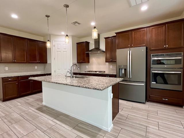 71 West Megan Street Gilbert, AZ 85233 - Photo 2 of 39 a kitchen with stainless steel appliances granite countertop a refrigerator a stove and a sink