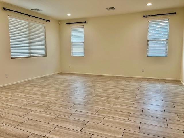 71 West Megan Street Gilbert, AZ 85233 - Photo 23 of 39 a view of an empty room with wooden floor and a window