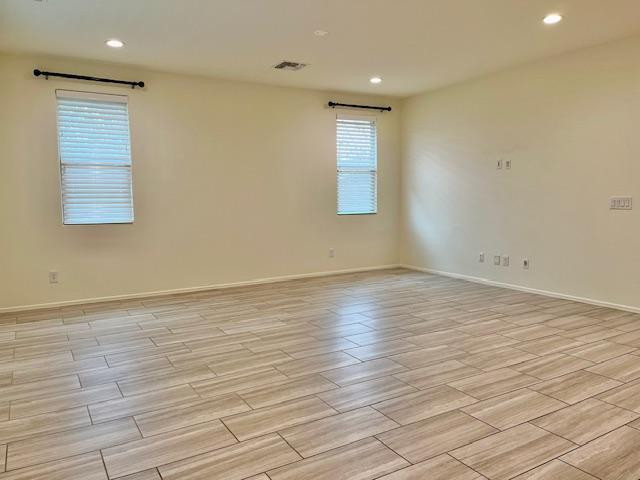 71 West Megan Street Gilbert, AZ 85233 - Photo 24 of 39 an empty room with wooden floor and windows