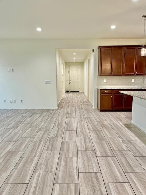 71 West Megan Street Gilbert, AZ 85233 - Photo 25 of 39 a view of kitchen with stainless steel appliances wooden floor and cabinets