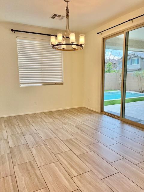 71 West Megan Street Gilbert, AZ 85233 - Photo 26 of 39 an empty room with wooden floor and windows